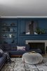 Modern home with Living Room, Ottomans, Light Hardwood Floor, Sofa, Sectional, and Standard Layout Fireplace. Living room with tone-on-tone navy walls and sofa. Photo 3 of Sea Cliff Preppy Contemporary