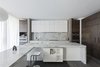 Modern home with Kitchen, Wall Oven, Range, Marble Counter, Wood Cabinet, Marble Backsplashe, Pendant Lighting, Recessed Lighting, and Drop In Sink. kitchen Photo 6 of Opposite House