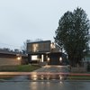 Modern home with Exterior, House Building Type, Wood Siding Material, Stucco Siding Material, Brick Siding Material, and Flat RoofLine. Main elevation Photo of Flipped House