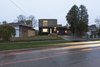 Modern home with Exterior, House Building Type, Stucco Siding Material, Brick Siding Material, Flat RoofLine, and Wood Siding Material. Main elevation Photo 2 of Flipped House