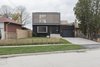 Modern home with Exterior, Wood Siding Material, Brick Siding Material, Stucco Siding Material, and Flat RoofLine. Main elevation Photo 3 of Flipped House