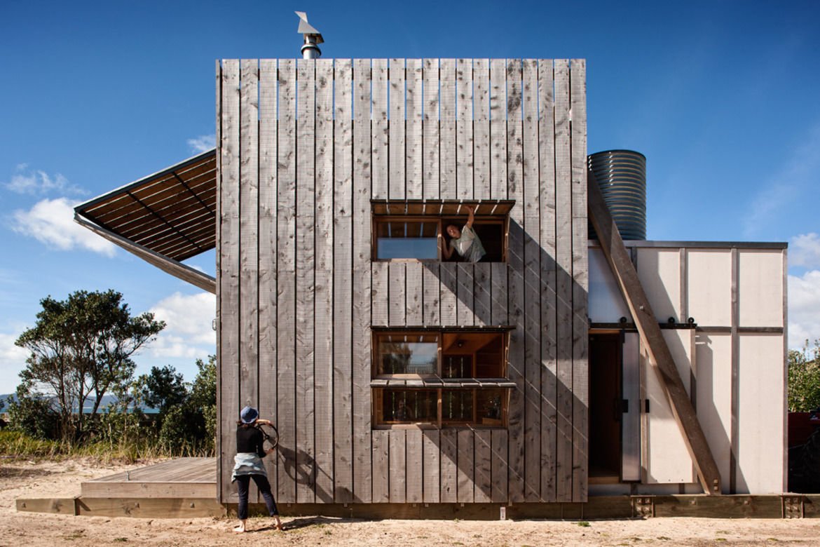 This clever take on a bach by Crosson Clarke Carnachan Architects sits atop two solid timber sleds that allow the beach house to be relocated as needed to cope with erosion of the site. The 430-square-foot retreat is located on the idyllic Coromandel Peninsula and sleeps a family of five. The textured macrocarpa cladding blends into the surrounding landscape, and it protects the home from the often harsh coastal environment.