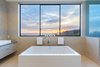 The master bath's soaking tub overlooks the sea Photo 3 of 2017 Pacific Palisades Custom Home Draws Breathtaking Views for $6.5 million modern home
