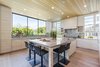 The kitchen includes a spacious center island Photo 5 of 2017 Pacific Palisades Custom Home Draws Breathtaking Views for $6.5 million modern home