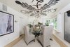 A cozy and warm dining room Photo 6 of Max Ember's Art Deco Inspired Streamline Moderne modern home