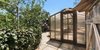 Comprised of five separate structures on some of the city’s most enchanting grounds, this exceptional gated compound in Brentwood boasts approximately an acre of incredible outdoor living space. Among its unique offerings are a large rose garden and greenhouse ideal for the budding gardener. An outdoor dining area with an enclosed chef’s kitchen, sprawling lawns and a swimming pool make for the perfect post-pruning retreat. Photo 3 of Four L.A. Homes with Phenomenal Outdoor Spaces for Spring modern home