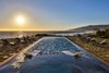 Breathtaking sunset over Zuma Beach and beyond Photo of Malibu Compound Designed By Douglas Burdge modern home