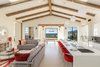 Kitchen and sitting nook designed with red accents and a hint of ocean views Photo 2 of Malibu Compound Designed By Douglas Burdge modern home