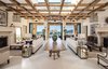 Enter into a planked foyer with stone fireplaces anchoring the entire room Photo 3 of Malibu Compound Designed By Douglas Burdge modern home