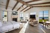 The master bedroom with repurposed church wood used to plank the ceiling Photo 6 of Malibu Compound Designed By Douglas Burdge modern home