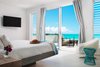 Upstairs bedrooms offer direct access to a sprawling oceanfront terrace. Photo 5 of Tip of the Tail Villa modern home