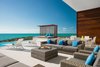 An expansive lounge area off the swimming pool is an incomparable retreat. Photo 6 of Tip of the Tail Villa modern home