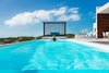 An incredible, glass-walled swimming pool overlooks the turquoise waters. Photo 7 of Tip of the Tail Villa modern home