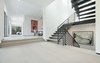 An airy foyer and light-filled corridor with sliding walls of glass and high ceilings that enhance the space and scale of every room. Photo 2 of Cherokee Contemporary modern home