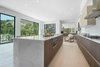 The gourmet Italian kitchen is complete with Miele appliances, a butler's pantry, eat-in island and Carrara marble countertops. Photo 5 of Cherokee Contemporary modern home
