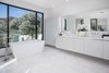 An elegant bathroom with standalone tub overlooks the hills. Photo 9 of Cherokee Contemporary modern home