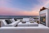 An outdoor gathering, dining and entertaining space with fireplace. Photo 2 of Carbon Beach modern home