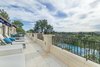 The expansive terrace off the master suite overlooks the pool and canyon views. Photo 6 of Benedict Canyon Villa modern home