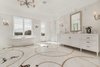 Refined marble floors and a standalone soaking tub in one of two master bathrooms. Photo 7 of Benedict Canyon Villa modern home