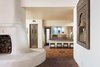 A double sided Moroccan fireplace boasts hand-painted details. Photo 4 of Malibu Colony Road modern home