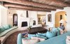 Wood beams soften a voluminous living room. Photo 5 of Malibu Colony Road modern home