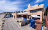 Ample outdoor entertaining space and steps down to the sand make this an incomparable retreat. Photo 11 of Malibu Colony Road modern home