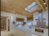 The open chef's kitchen feels like a natural extension of the home. Photo 11 of Midcentury Post and Beam In Fryman Canyon modern home