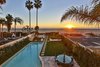 Modern home with Back Yard, Large Pools, Tubs, Shower, Large Patio, Porch, Deck, Tile Patio, Porch, Deck, Wood Fences, Wall, and Outdoor. A generous outdoor area boasts a large swimming pool and dining areas, with a gate opening directly onto the beach. Photo 2 of A Santa Monica Beach House Built for Norma Talmadge
