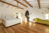 Modern home with Large Pools, Tubs, Shower, Back Yard, Landscape Lighting, Chair, Tile Patio, Porch, Deck, Large Patio, Porch, Deck, Wood Fences, Wall, Sofa, Ottomans, Wall Lighting, Dark Hardwood Floor, Wood Burning Fireplace, Ceiling Lighting, Table, Interior, Swing Door Type, and Bedroom. An expansive master suite features a vaulted ceiling and fireplace with charming built-ins. Photo 6 of A Santa Monica Beach House Built for Norma Talmadge
