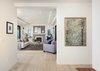 Modern home with Hallway and Light Hardwood Floor. The home is perfectly suited to an art collection. Photo 3 of A 1930s Spanish Colonial in Los Feliz Reimagined for the 21st Century