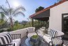 Modern home with Outdoor, Small Patio, Porch, Deck, and Tile Patio, Porch, Deck. A tiled patio off an upstairs bedroom is a peaceful retreat, overlooking views of Hollywood and Century City all the way to the ocean. Photo 6 of A 1930s Spanish Colonial in Los Feliz Reimagined for the 21st Century