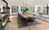 Modern home with Dining Room, Table, Chair, Accent Lighting, Light Hardwood Floor, and Recessed Lighting. Contemporary fixtures and furnishings give the formal dining room a clean, contemporary appeal. Photo 7 of A 1930s Spanish Colonial in Los Feliz Reimagined for the 21st Century