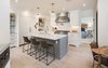 Modern home with Kitchen, Light Hardwood Floor, White Cabinet, Marble Counter, Subway Tile Backsplashe, Accent Lighting, Recessed Lighting, Range, Range Hood, Dishwasher, Refrigerator, Cooktops, and Drop In Sink. The remodeled and remastered chef’s kitchen features integrated Thermadore refrigeration, a Wolf range, center Carrara slab island and custom built-ins. Photo 8 of A 1930s Spanish Colonial in Los Feliz Reimagined for the 21st Century