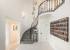 Modern home with Staircase, Stone Tread, and Metal Railing. The home’s original magnesite staircase leads to the perfect family floor plan. Photo 9 of A 1930s Spanish Colonial in Los Feliz Reimagined for the 21st Century