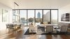 Modern home with Living Room. The penthouse great room with expansive windows and far-reaching city views. Photo 2 of The Residences at The Sawyer
