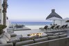 Modern home with Outdoor. The limestone fire pit and pool terrace at twilight. Photo 7 of A Contemporary Makeover Transforms Oceanfront Villa Serena