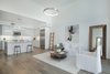 Modern home with Living Room. The bright, white great room features gallery walls and soaring ceilings. Photo 2 of It’s All About The Light at AIRE Santa Monica