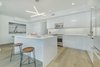 Modern home with Kitchen, Ceiling Lighting, White Cabinet, and Pendant Lighting. Open kitchens feature German-made Leicht cabinetry, Caesarstone countertops, wide-plank French, white oak flooring, Viking Professional and LG Smart Technology appliances. Photo 3 of It’s All About The Light at AIRE Santa Monica