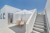 Modern home with Outdoor and Rooftop. The two-story rooftop terraces capture views encompassing the Pacific Ocean, Century City and Hollywood Hills. Photo 6 of It’s All About The Light at AIRE Santa Monica