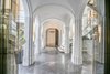 Towering ceilings and contrasting marble arches and floors lend the interiors a dramatic and refined air. Photo 3 of Architecturally Inspired Living in Beverly Hills modern home