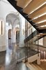 An in-home elevator off the architectural staircase ascends to the staggering master suite. Photo 8 of Architecturally Inspired Living in Beverly Hills modern home