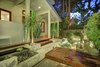 A serene Koi water garden provides a moment of quietude before entering the main residence. Photo of Sleek West Hollywood Contemporary modern home