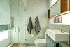 An elegant master bathroom with a glass-enclosed shower and contemporary sink Photo 8 of Sleek West Hollywood Contemporary modern home