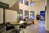 Double height ceilings, plentiful windows, and aged hardwood floors compliment the guesthouse. Photo 10 of Sleek West Hollywood Contemporary modern home