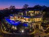 The home's exquisite infinity pool glows against the L.A. skyline. Photo of A Showpiece on Shadow Hill modern home