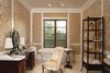 A sumptuous master bath showcases marble top vanities, upholstered walls, dual showroom closets, hand-cut marble flooring and a deep, free-standing soaking tub.
Photo 7 of A Wallace Neff Inspired Masterpiece in Desert Highlands modern home