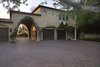 Mirroring the intricate details throughout the main home, a guest casita features an intimate kitchen with a Gaggeneu cooktop, spacious bedroom, laundry room, and luxurious bathroom.
Photo 8 of A Wallace Neff Inspired Masterpiece in Desert Highlands modern home