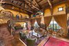 The living area with soaring 25-foot ceilings and archways that opens to the sea view. Photo 4 of Castillo del Mar Brings Italian Style to Pacific Palisades modern home