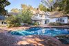 Modern home with Exterior, Shingles Roof Material, House, Wood Siding Material, and Gable RoofLine. Set on nearly an acre of picturesque grounds, the home is perfectly suited for grand-scale entertaining. Photo 6 of Authentic 1930s Country English Compound in Fryman Canyon