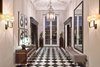 Modern home with Hallway. An elegant entry with soaring ceilings and black and white checkered marble floors leads to grand-scale living spaces expertly curated to reflect the California lifestyle with a sophisticated, country club tone. Photo 2 of Old Hollywood Glamour With Modern Appeal in Bel Air